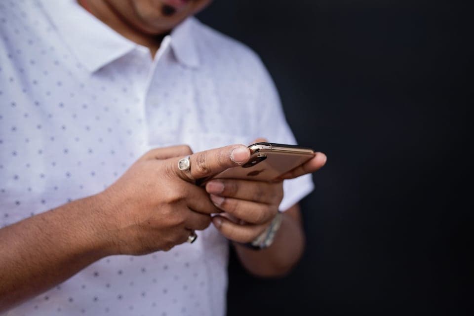 Close-up of someone typing a message on a smartphone